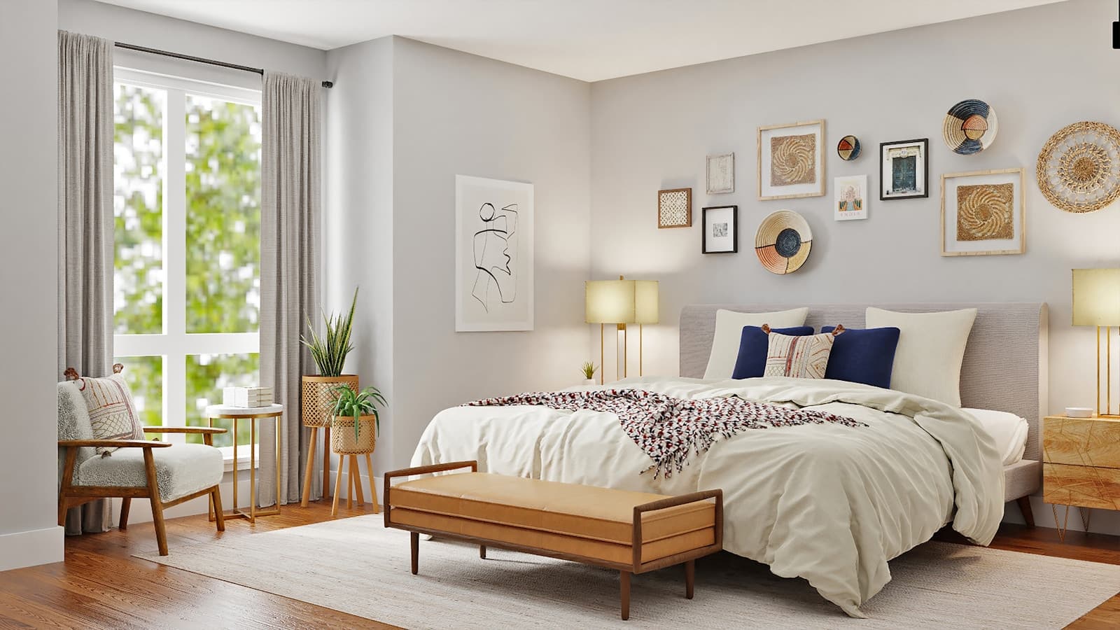 White bedroom with framed artwork above the bed