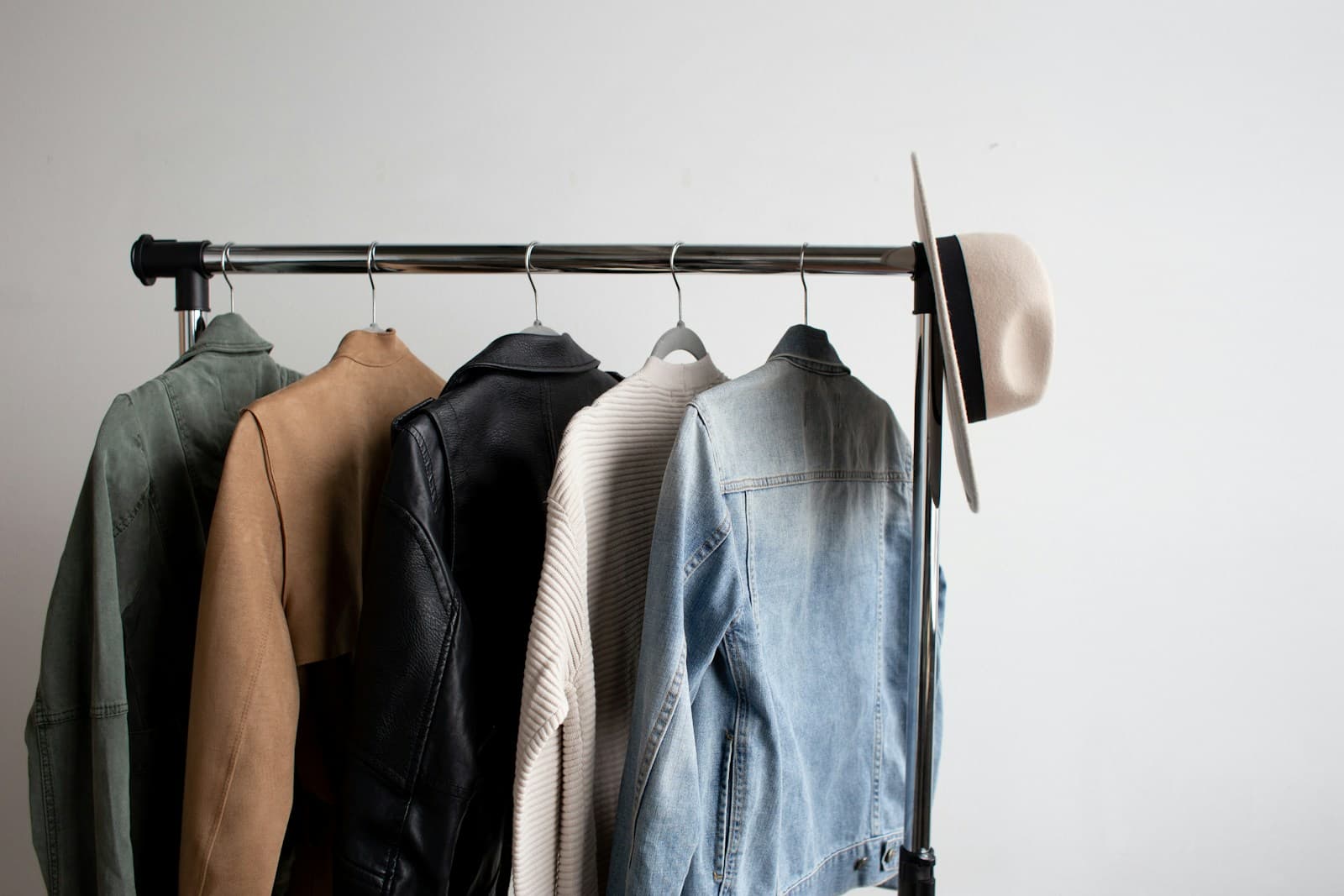 Neatly hung jackets on a freestanding clothing rail